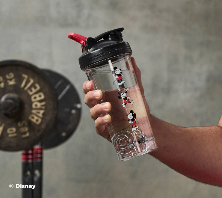 pro-series-w7 Mickey_Mouse_Protein_Shaker_Bottle_Being_Held_In_the_Gym.jpg